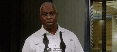 A Man In A White Shirt And Bow Tie Is Standing In Front Of A Window And Says `` Oh , Damn '' . GIF