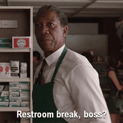 A Man In A White Shirt And Green Apron Says " Restroom Break Boss " GIF