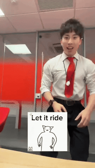 A Man In A White Shirt And Red Tie Is Dancing In Front Of A Sign That Says " Let It Ride " GIF