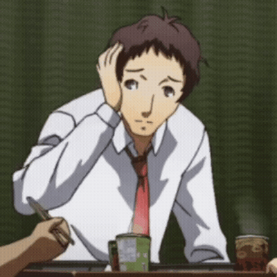 A Man In A White Shirt And Red Tie Sitting At A Table GIF