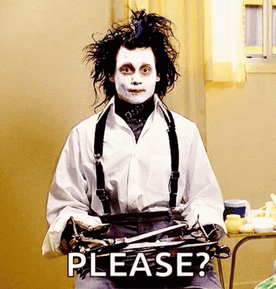 A Man In A White Shirt And Suspenders Is Holding A Pair Of Scissors And Saying Please . GIF
