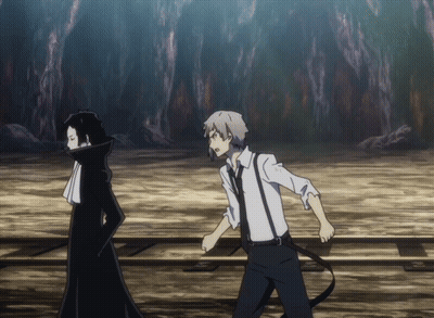 A Man In A White Shirt And Suspenders Is Standing Next To A Man In A Black Coat GIF