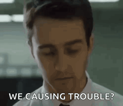 A Man In A White Shirt And Tie Is Asking If He Is Causing Trouble GIF