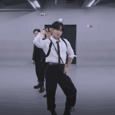 A Man In A White Shirt And Tie Is Dancing GIF