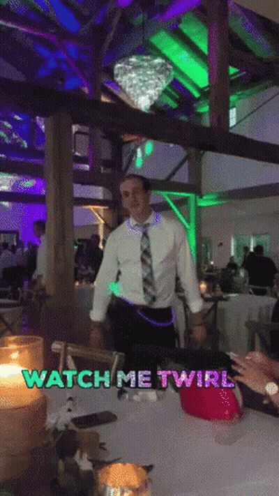 A Man In A White Shirt And Tie Is Dancing In A Room With The Words Watch Me Twirl On The Bottom GIF