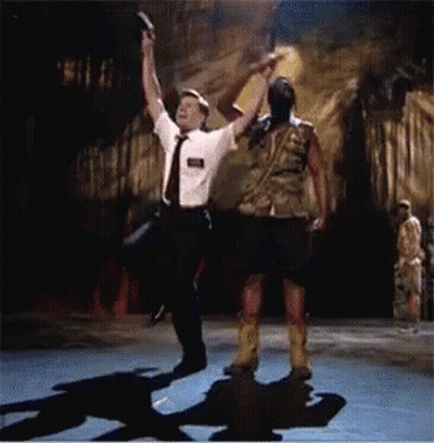 A Man In A White Shirt And Tie Is Dancing With A Man In A Kilt GIF