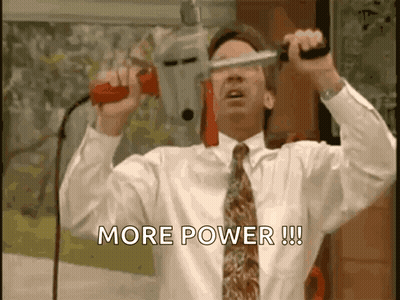 A Man In A White Shirt And Tie Is Holding A Drill And Says More Power GIF