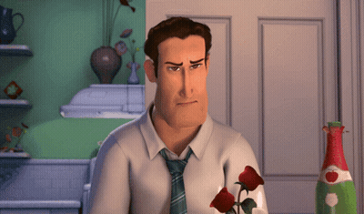 A Man In A White Shirt And Tie Is Holding Two Red Roses GIF