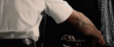 A Man In A White Shirt And Tie Is Pressing A Button On A Computer Keyboard . GIF