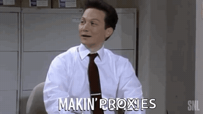 A Man In A White Shirt And Tie Is Sitting At A Desk And Saying Makin ' Proxies GIF