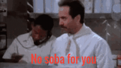 A Man In A White Shirt And Tie Is Sitting At A Desk And Says No Soba For You GIF