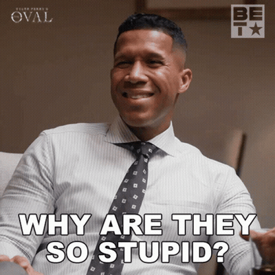 A Man In A White Shirt And Tie Is Smiling And Says Why Are They So Stupid GIF