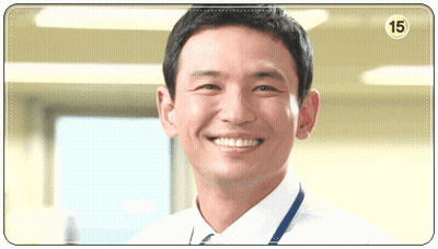 A Man In A White Shirt And Tie Is Smiling With The Number 15 On The Corner GIF