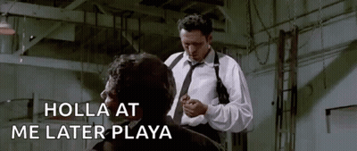 A Man In A White Shirt And Tie Is Standing Next To Another Man In A Room . GIF