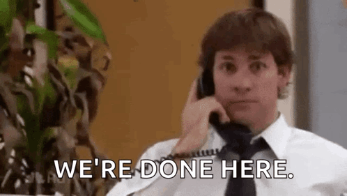 A Man In A White Shirt And Tie Is Talking On A Phone And Saying `` We 'Re Done Here '' . GIF
