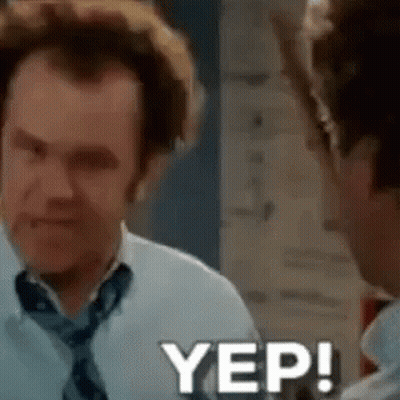 A Man In A White Shirt And Tie Is Talking To Another Man In A Room . GIF