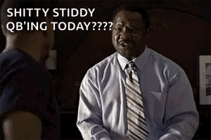 A Man In A White Shirt And Tie Is Talking To Another Man . GIF
