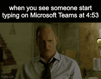 A Man In A White Shirt And Tie Is Typing On Microsoft Teams At 4:55 GIF