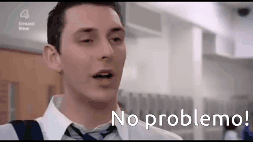 A Man In A White Shirt And Tie Says No Problema GIF