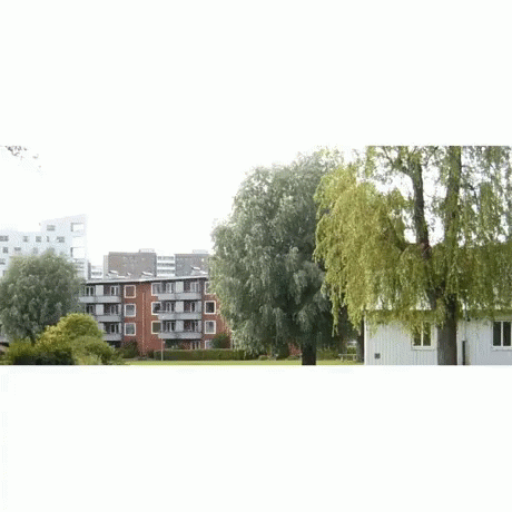 A Man In A White Shirt And Yellow Pants Is Dancing GIF