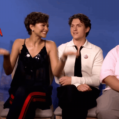 A Man In A White Shirt Has A Button That Says ' I Love You ' GIF