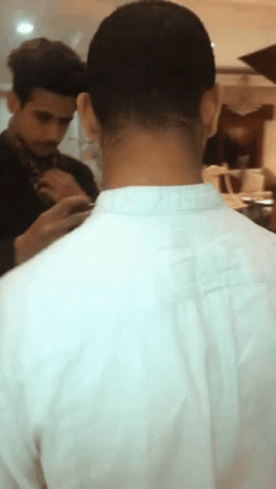 A Man In A White Shirt Has A Tattoo On His Neck That Says ' I Love You ' GIF