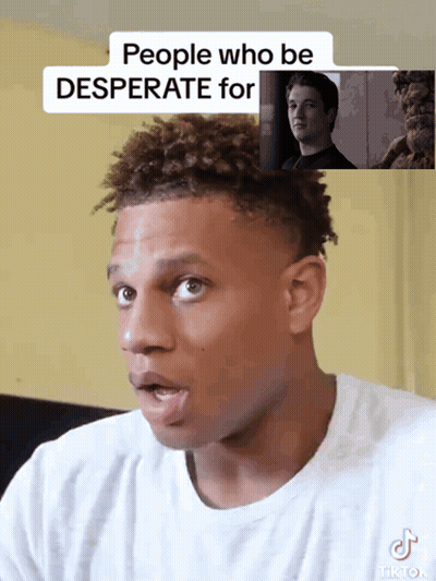 A Man In A White Shirt Has A Tiktok Sticker On His Shirt GIF