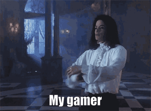 A Man In A White Shirt Has His Arms Outstretched And Says " My Gamer " On The Bottom GIF