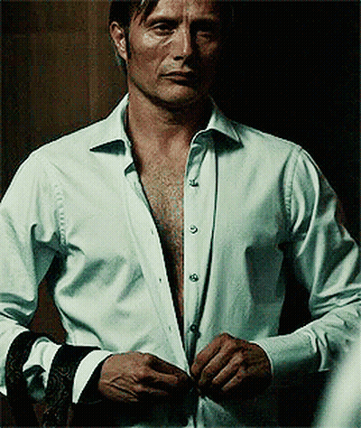 A Man In A White Shirt Has His Shirt Open GIF