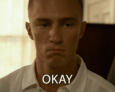 A Man In A White Shirt Has The Word Okay Written On His Neck GIF