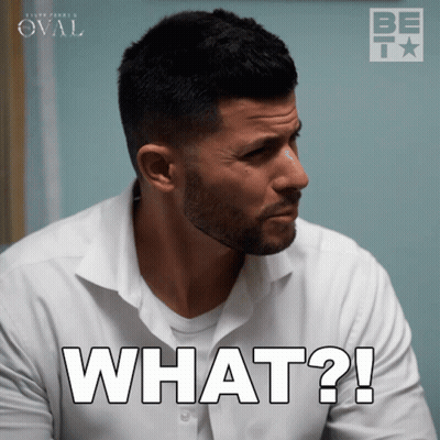 A Man In A White Shirt Has The Word What On His Face GIF