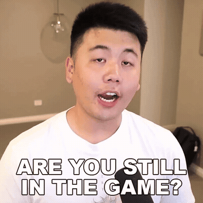 A Man In A White Shirt Is Asking " Are You Still In The Game " GIF