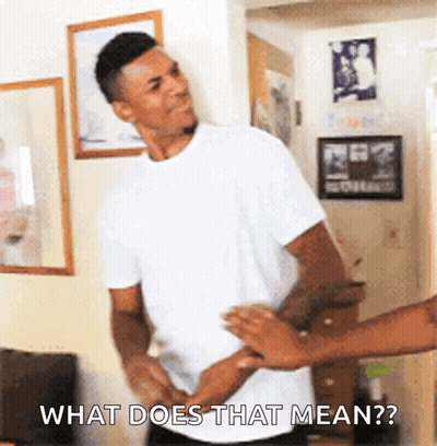 A Man In A White Shirt Is Being Held By Another Man And Says What Does That Mean GIF