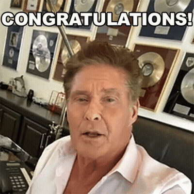 A Man In A White Shirt Is Congratulating Someone GIF