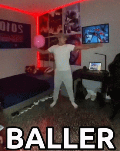 A Man In A White Shirt Is Dancing In A Room With The Word Baller Above Him GIF
