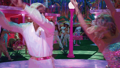 A Man In A White Shirt Is Dancing With A Woman In A Pink Outfit GIF