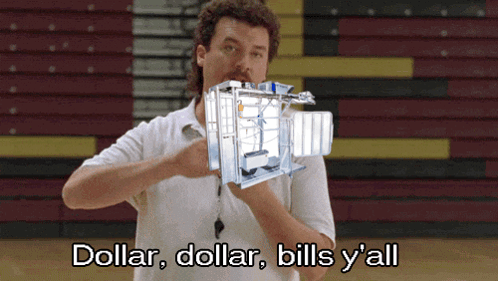 A Man In A White Shirt Is Holding A Machine That Says Dollar Dollar Bills Y All GIF