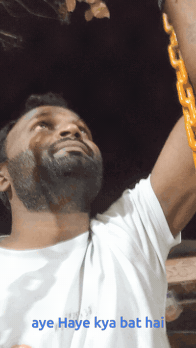 A Man In A White Shirt Is Holding A Yellow Chain And The Caption Aye Haye Kya Bat Hai GIF