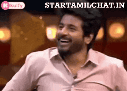 A Man In A White Shirt Is Laughing With The Words Starttamilchat.in Behind Him GIF