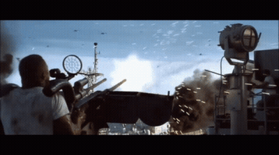 A Man In A White Shirt Is Looking Through A Sniper Scope At A Military Explosion GIF
