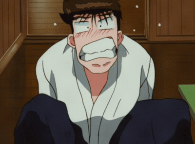 A Man In A White Shirt Is Making A Surprised Face GIF