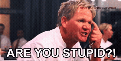 A Man In A White Shirt Is Pointing His Finger At His Head And Says " Are You Stupid " GIF