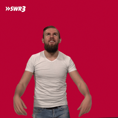 A Man In A White Shirt Is Raising His Hands In The Air With A Swr3 Logo In The Background GIF