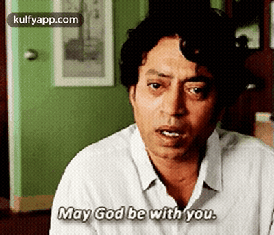 A Man In A White Shirt Is Saying `` May God Be With You . '' GIF