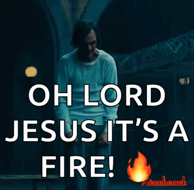 A Man In A White Shirt Is Saying Oh Lord Jesus It 'S A Fire .. GIF