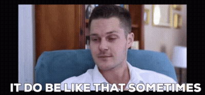 A Man In A White Shirt Is Sitting In A Chair With The Words `` It Do Be Like That Sometimes '' Written Above Him . GIF