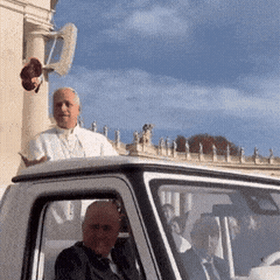 A Man In A White Shirt Is Sitting In A White Car GIF