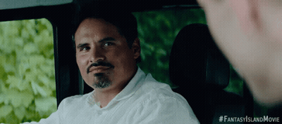 A Man In A White Shirt Is Sitting In The Back Seat Of A Car With #Fantasyislandmovie Written On The Bottom Right GIF