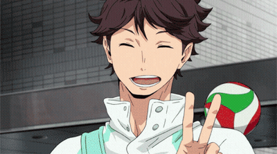 A Man In A White Shirt Is Smiling And Giving A Peace Sign GIF