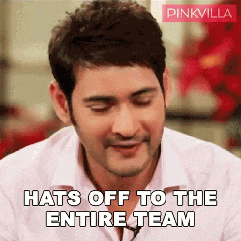 A Man In A White Shirt Is Smiling And Says Hats Off To The Entire Team GIF